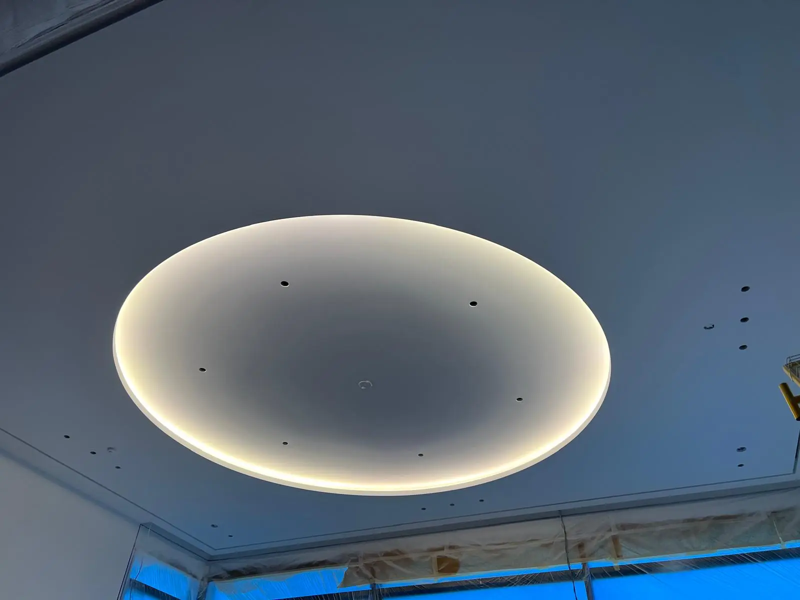 Circular cove-lit ceiling detail finished in drywall.